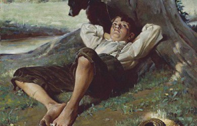 boy relaxing under a tree