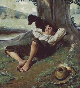 boy, dog lounging under a tree